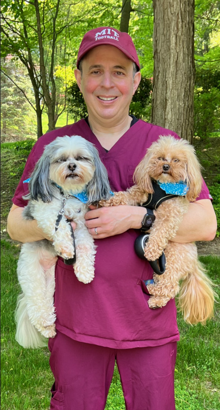 Dr. Fishman with Rocky and Rambo about to go on an after work walk.